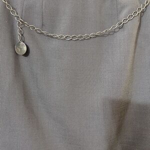 Stainless Steel Chain Belt. Has a Round Medallion at the end. measures 35” Inch